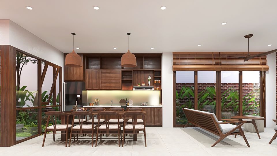 Phòng bếp được thiết kế liên thông với phòng ăn, nội thất ứng dụng chất liệu gỗ tự nhiên mềm mại ấn cúng nổi bật trên tông màu sáng của sơn nhà và nên gạch.